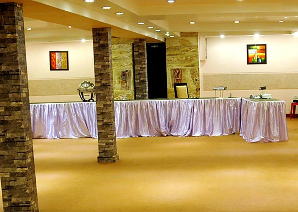 Spacious banquet hall with buffet tables at Temptation, Agra