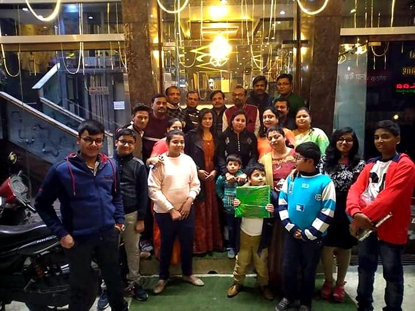 A large family celebrating outside Temptation's entrance